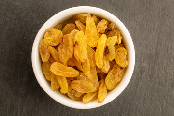 Bright golden sweet raisins top view, macro.