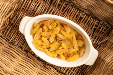 Bright golden sweet raisins top view, macro.
