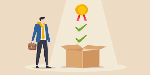 A man looks at a golden award emerging from an open cardboard box