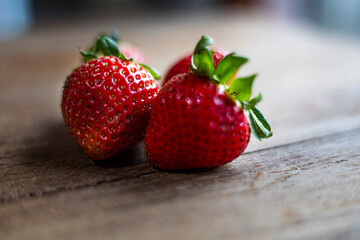 Fresh Strawberry Resting On Wooden Table