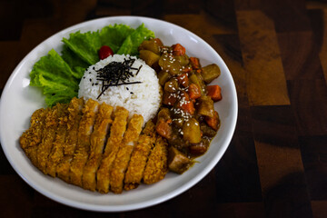 Fried Chicken Curry Rice On A Plate Placed On A Wooden Table
