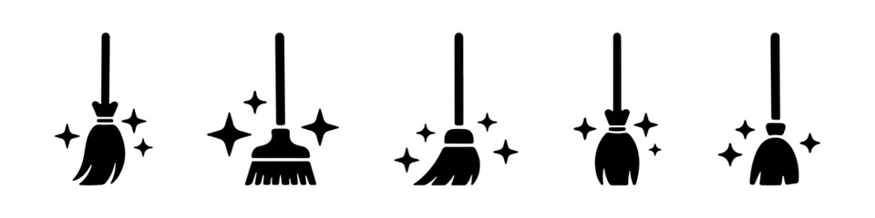 A collection of broom icons with sparkling effects, symbolizing cleaning and tidiness.