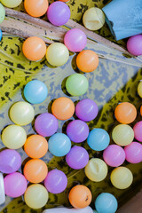 Vibrant Balls Adrift in Stagnant Tub Glow