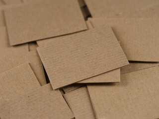 Heap of overlapping brown cardboard pieces. Full frame. Close-up