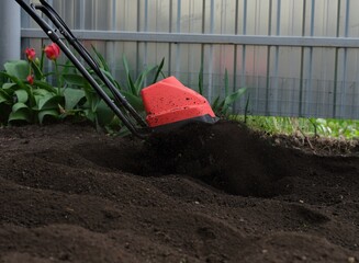 Soil being tilled using cultivator