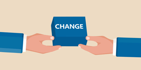 Hands holding a blue card with the word change written on it