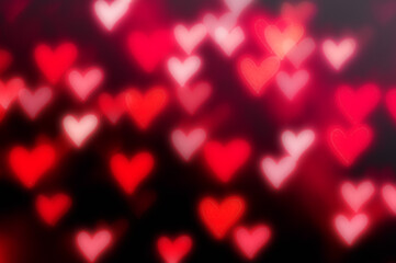 St Valentines Day red heart bokeh background with defocused light hearts, St Valentine's day symbol