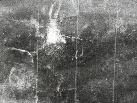 Abstract black and white grunge texture background with vertical scratches and distressed old surface.