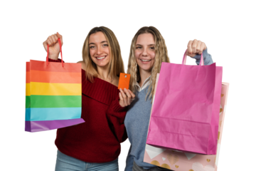 Happy young women holding shopping bags and credit card
