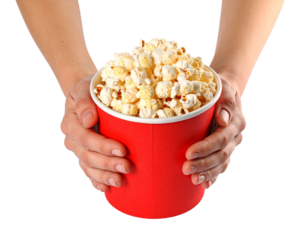 Hand Holding Popcorn in a Paper Bucket on Transparent Background

