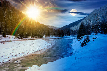 mountain river in winter. day and night time change concept. landscape with spruce forest and snow covered shore with sun and moon. beautiful nature scenery in valley. equality and shift template
