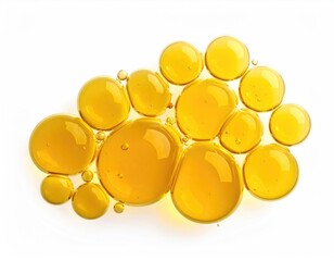 Honey-colored globules on white background