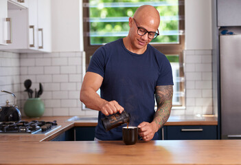 Fit Man Pouring Coffee In Modern Kitchen, Glasses On, Morning Routine At Home