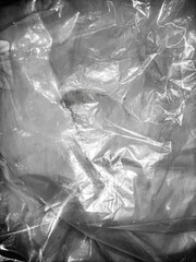 crumpled plastic bag texture on a dark surface