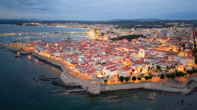 Aerial view of evening seaside fortress, scenic drone footage captures italian coast fortress during sunset evening. Algero