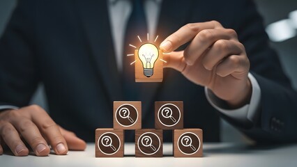 Businessman placing idea light bulb cube, finding solutions for business