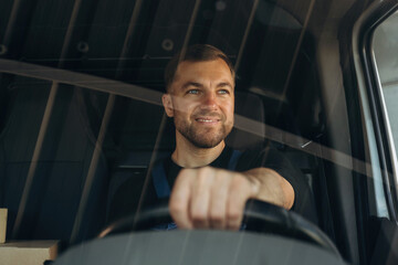 Front view of delivery man that is driving a van