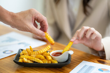 Sharing delicious crinkle cut fries with dipping sauce restaurant table food photography cozy environment close-up view culinary experience