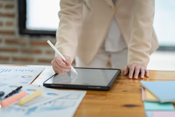 Creating digital art a business professional using tablet technology in a modern office environment