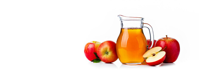 Carafe of apple juice. Apples on the table. On a white background.