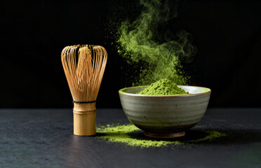 Vibrant green matcha powder falling into a ceramic bowl, next to a traditional bamboo whisk. Japanese tea culture, healthy lifestyle, and wellness. 