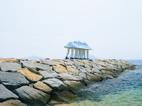 Walking Ark sculpture on Ogijima island coastal breakwater in Seto Inland Sea