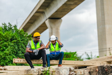 Tired Railway Workers Encouraging Each Other