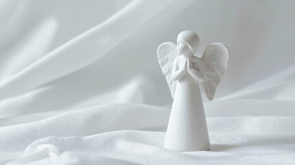 minimal white angel figurine, smooth porcelain, dreamy cold-white background