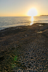 Sunset on Cane Malu beach in Sardinia.