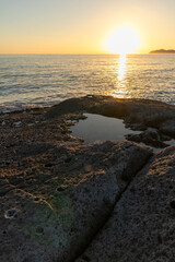 Sunset on Cane Malu beach in Sardinia.