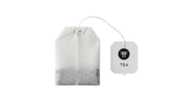 Close up of a white paper tea bag with string and tag isolated on transparent background