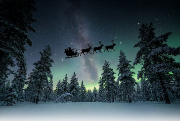 Santa Claus flying through the sky on Christmas night