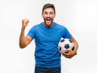 Young man holding soccer ball celebrating victory