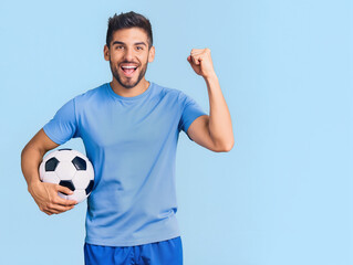 Happy soccer player celebrating goal and victory