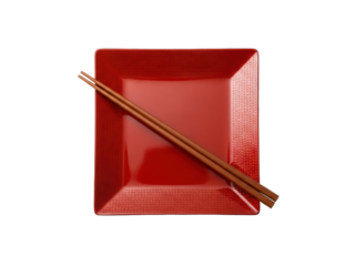 Isolated red square plate with chopsticks for eating at restaurant or kitchenware design