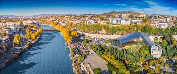 Aerial view of Tbilisi showing the Kura River, modern architecture © EdNurg