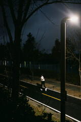 silhouette of a man walking on the street