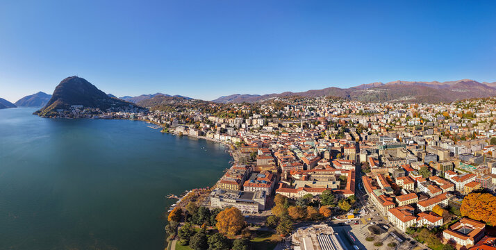 Lugano city aerial view, Lake Lugano and surrounding mountains. Lugano, Canton of Ticino, Switzerland. - Powered by Adobe
