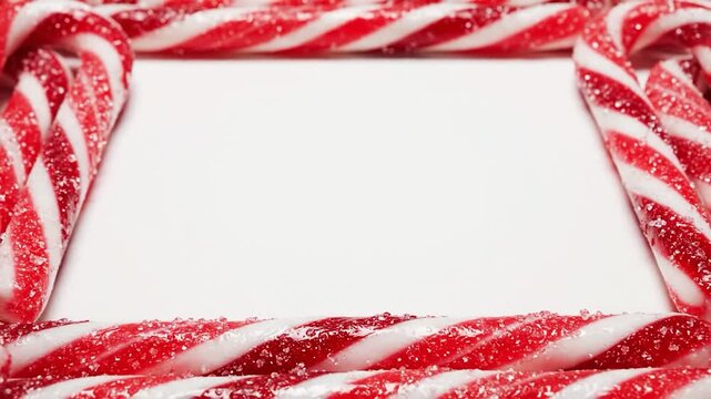 A beautiful red Christmas heart frame with a sweet candy cane ribbon bow for a holiday gift card design