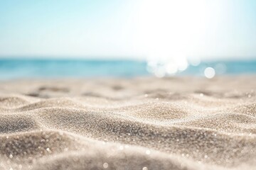 Soft sparkling beach sand in warm sunlight with calm turquoise ocean in the distance, ideal for summer marketing, travel branding, relaxation themes, and minimal design projects