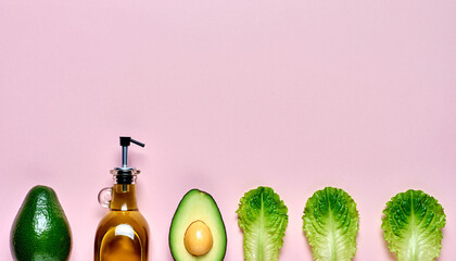 Vibrant flatlay of salad ingredients promises fresh healthy meals and mindful eating with avocados and olive oil on pink