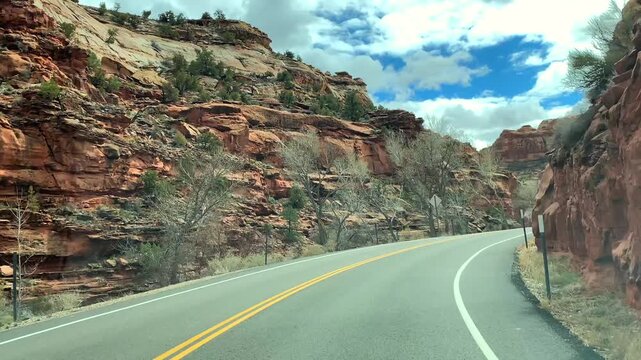 POV road trip through Utah and Arizona along Route 12 and Highway 95, with scenic canyons, mesas, red rocks and desert landscapes. Horizontal and vertical footage.