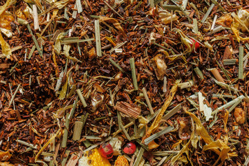 Rooibos tea blend with orange pieces and natural ingredients close up