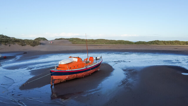 Aerial view of the Barmouth lifeboat on the tidal sands