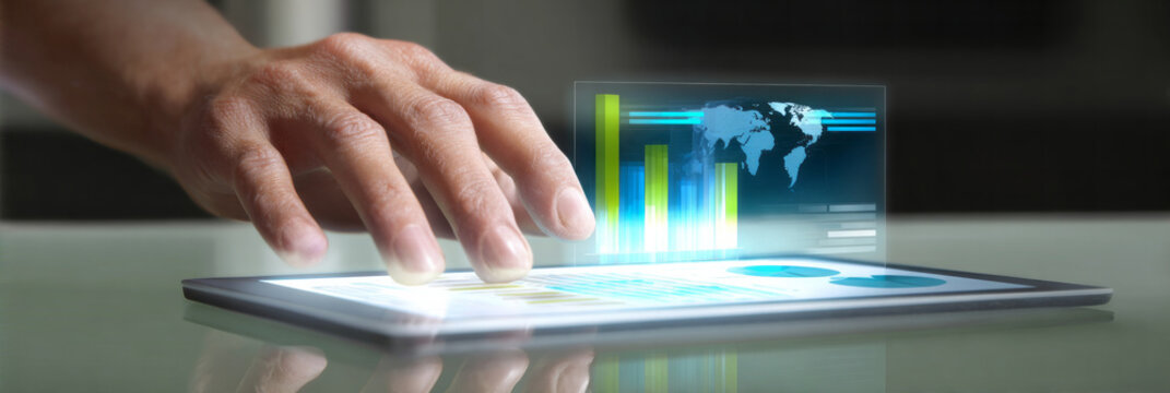 Hand touching holographic chart displaying global business data and financial analytics from a futuristic tablet - Powered by Adobe
