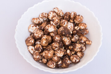 Healthy jaggery chocolate makhana snack in a white bowl