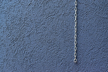 Gray wall texture background and metal chain in Ribeirao Preto, Brazil