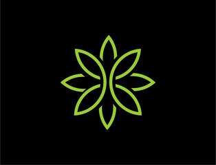 Abstract floral design with green leaves on black