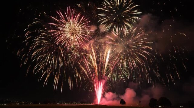 rocket fireworks display explotion in the night sky