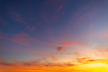 Fototapeta premium Clouds and sky at sunrise and sunset,Clouds and sky at sunrise and sunset,Sunset sky clouds in the evening with Orange gold sunlight in golden hour, Panoramic Horizon sky background 
